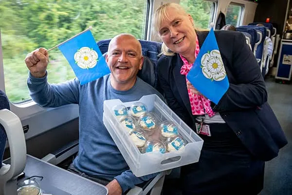 Passenger celebrating Yorkshire Day on board a Hull Trains service