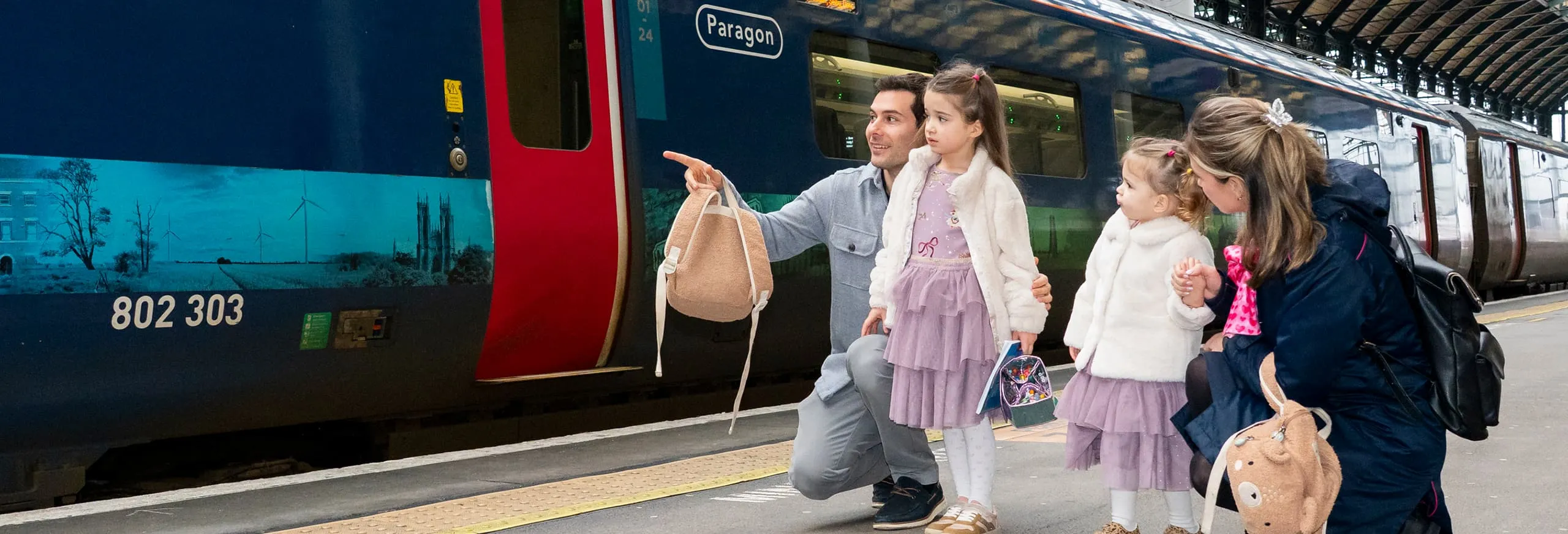 A family travelling onboard a Hull Trains service with kids packs