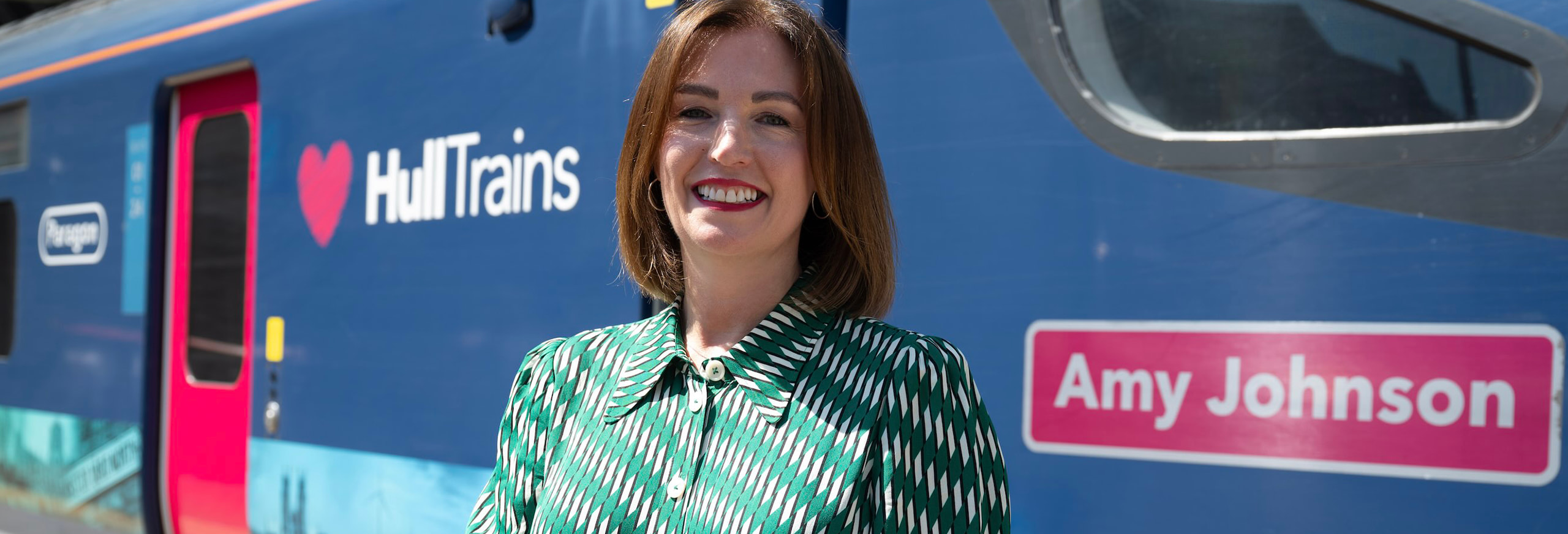 A photo of a member of Hull Trains staff outside of a train