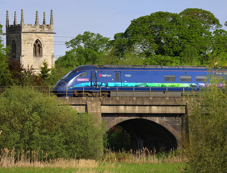 Hull Trains on route passing a church