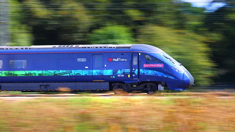 A fast image of a Hull Trains service passing fields on route