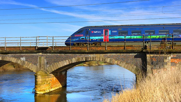 Hull Trains passing a bridge with water