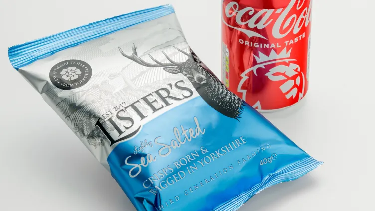 A photo of Listers crisps and a can of soft drink